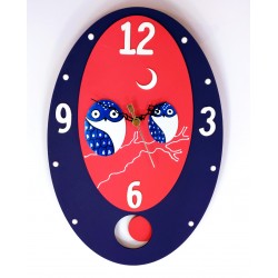 34. Reloj de pared ovalado 22x33cm. Búhos azules.